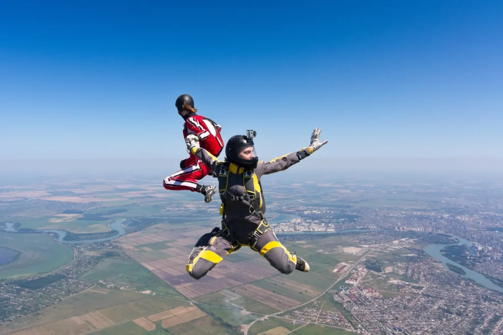 Skydiver in freefall wearing a rig